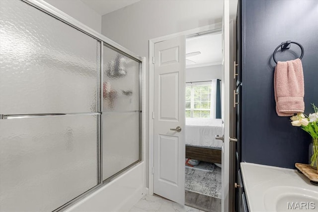 27 Kassebaum Ln Unit 302, Mehlville, MO 63129 - bathroom with ensuite bathroom, marble look tiles, combined bath / shower with glass door, and vanity