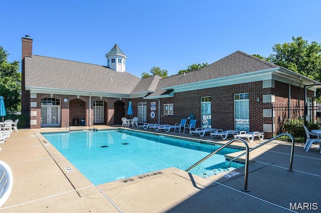 27 Kassebaum Ln Unit 302, Mehlville, MO 63129 - community pool featuring a patio area and french doors