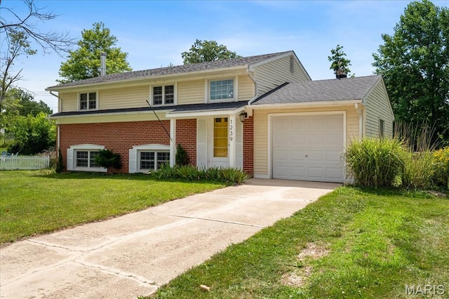1239 Vero Ln, Ellisville, MO 63011 - traditional home with concrete driveway, a garage, and brick siding