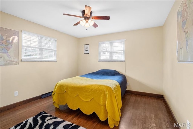 1239 Vero Ln, Ellisville, MO 63011 - bedroom featuring multiple windows, wood finished floors, and ceiling fan