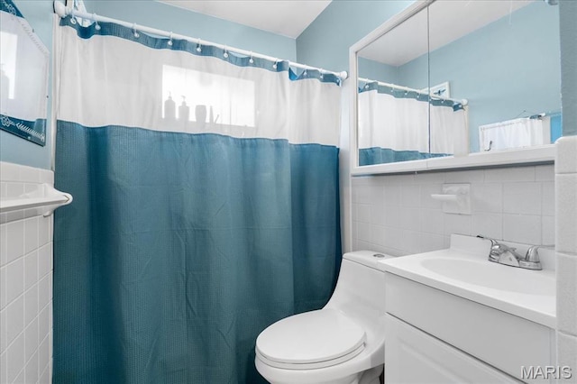 1239 Vero Ln, Ellisville, MO 63011 - full bathroom featuring tile walls, vanity, and a shower with curtain
