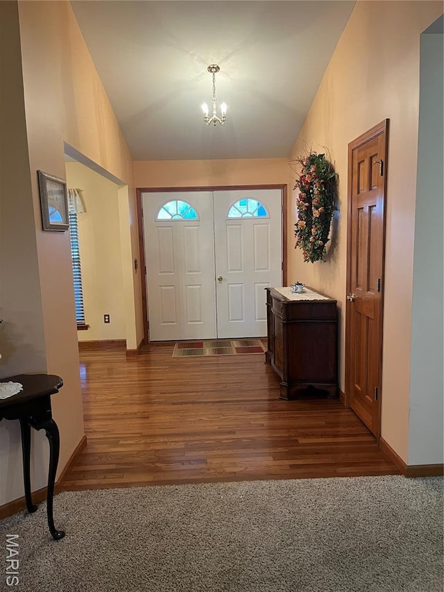 3 Boxwood Crest Ct, Ofallon, MO 63366 - carpeted entrance foyer featuring vaulted ceiling, a chandelier, and wood finished floors
