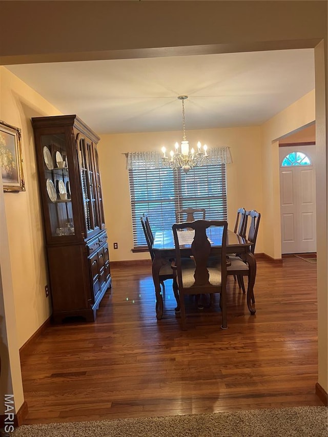 3 Boxwood Crest Ct, Ofallon, MO 63366 - dining area featuring a chandelier and dark wood-style flooring