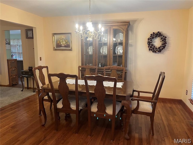 3 Boxwood Crest Ct, Ofallon, MO 63366 - dining space featuring a chandelier and dark wood-style flooring