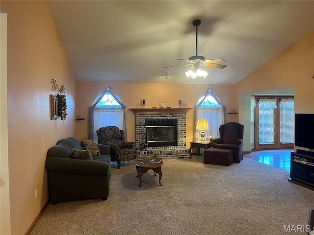 3 Boxwood Crest Ct, Ofallon, MO 63366 - carpeted living room featuring lofted ceiling, a ceiling fan, and a fireplace