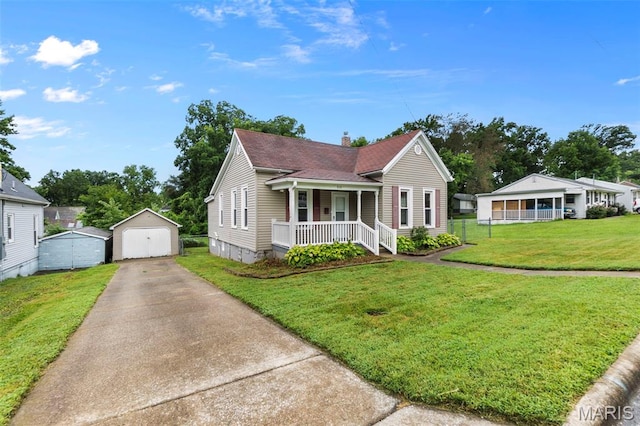 713 W Adams St, Jackson, MO 63755 - bungalow-style house featuring covered porch, concrete driveway, a chimney, a front lawn, and a garage