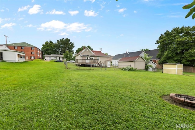 713 W Adams St, Jackson, MO 63755 - view of yard featuring a fire pit and a storage unit