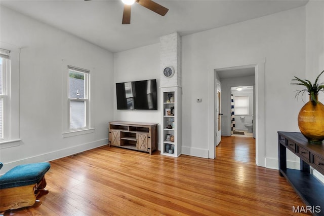 713 W Adams St, Jackson, MO 63755 - living area with a ceiling fan and light wood-style flooring