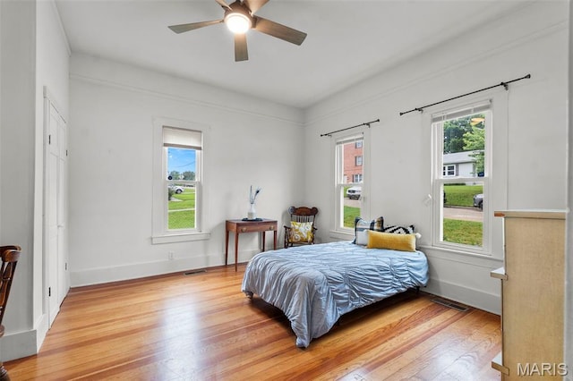 713 W Adams St, Jackson, MO 63755 - bedroom with light wood-style flooring and ceiling fan