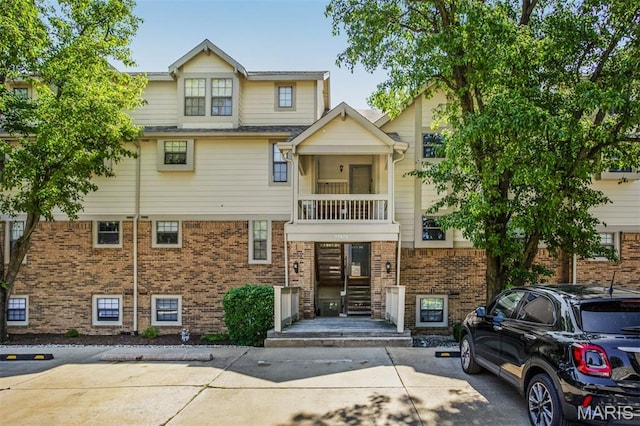 12975 Bryce Canyon Dr Unit D, Maryland Heights, MO 63043 - view of front facade with a balcony and brick siding