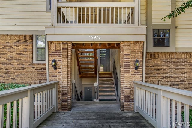 12975 Bryce Canyon Dr Unit D, Maryland Heights, MO 63043 - doorway to property featuring brick siding and a wooden deck