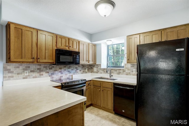 12975 Bryce Canyon Dr Unit D, Maryland Heights, MO 63043 - kitchen with black appliances, decorative backsplash, light countertops, brown cabinets, and light tile patterned floors