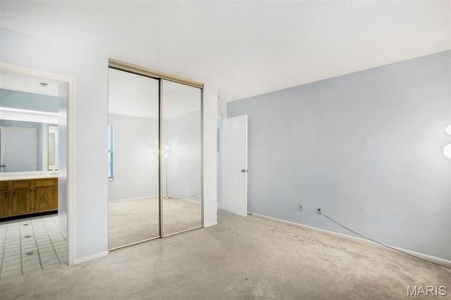 12975 Bryce Canyon Dr Unit D, Maryland Heights, MO 63043 - unfurnished bedroom featuring light carpet and a closet