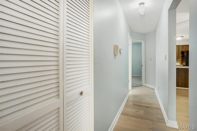 12975 Bryce Canyon Dr Unit D, Maryland Heights, MO 63043 - hallway featuring light wood-style flooring and baseboards