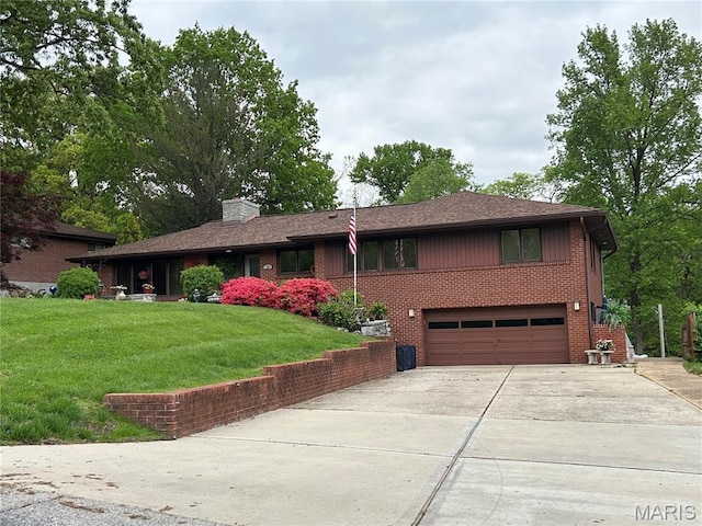 15 Lake Pembroke Dr, Ferguson, MO 63135 - view of front of home featuring concrete driveway, an attached garage, brick siding, a chimney, and a front lawn