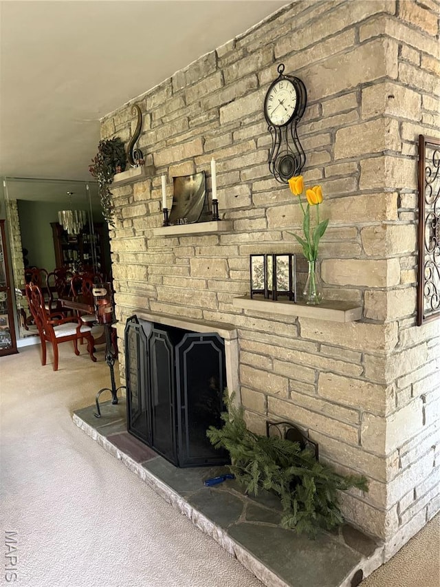 15 Lake Pembroke Dr, Ferguson, MO 63135 - carpeted living room with a stone fireplace