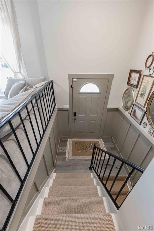 3712 Gail Dr, Imperial, MO 63052 - staircase with wainscoting, a decorative wall, healthy amount of natural light, and wood finished floors