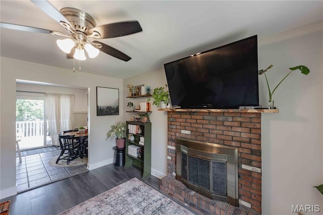3712 Gail Dr, Imperial, MO 63052 - living area with a brick fireplace, ceiling fan, and wood finished floors