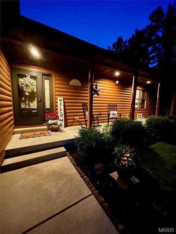 5156 Mccallister Rd, Gerald, MO 63037 - doorway to property featuring faux log siding