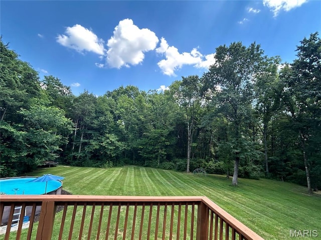 5156 Mccallister Rd, Gerald, MO 63037 - view of grassy yard featuring an outdoor pool, a deck, and a wooded view