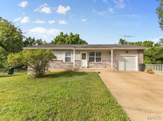 4213 Flucom Rd, De Soto, MO 63020 - single story home featuring brick siding, an attached garage, and driveway