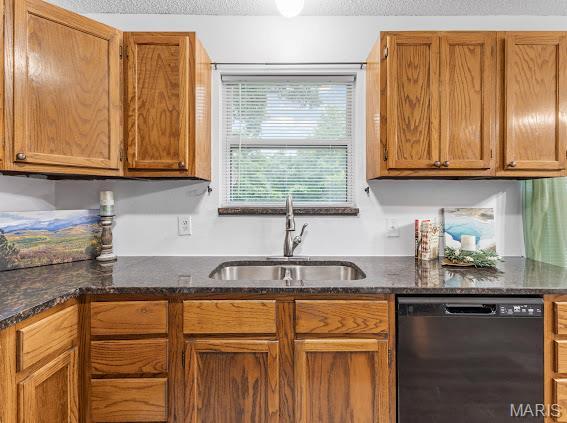 4213 Flucom Rd, De Soto, MO 63020 - kitchen with dishwasher, dark stone counters, and brown cabinets