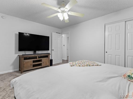 4213 Flucom Rd, De Soto, MO 63020 - bedroom featuring a textured ceiling, a closet, ceiling fan, and carpet