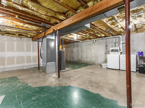 4213 Flucom Rd, De Soto, MO 63020 - unfinished below grade area with separate washer and dryer, heating unit, and water heater
