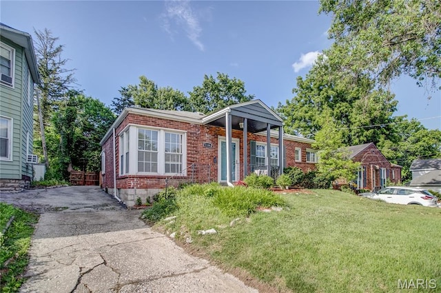 1106 Danforth St, Alton, IL 62002 - view of front of property featuring brick siding, a front lawn, and driveway