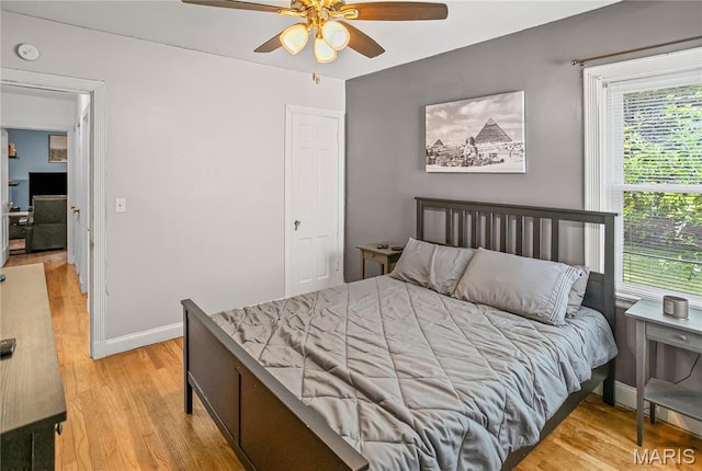 1106 Danforth St, Alton, IL 62002 - bedroom with light wood-style floors, multiple windows, and ceiling fan