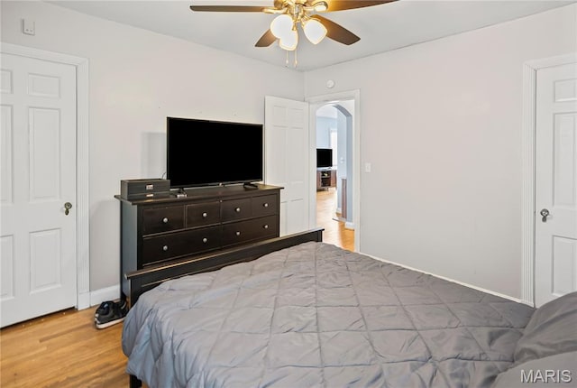 1106 Danforth St, Alton, IL 62002 - bedroom featuring arched walkways, wood finished floors, and a ceiling fan