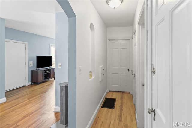 1106 Danforth St, Alton, IL 62002 - hall with light wood-type flooring and arched walkways