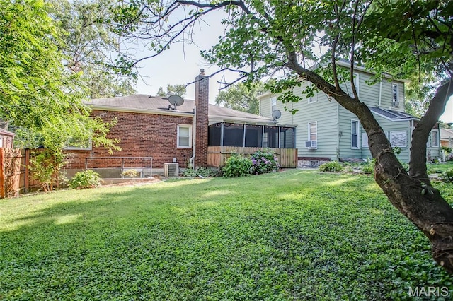 1106 Danforth St, Alton, IL 62002 - back of property featuring a sunroom, a chimney, and brick siding