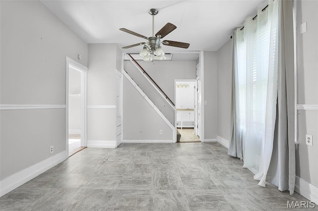 111 N Duncan St, Marine, IL 62061 - empty room with a ceiling fan and stairs