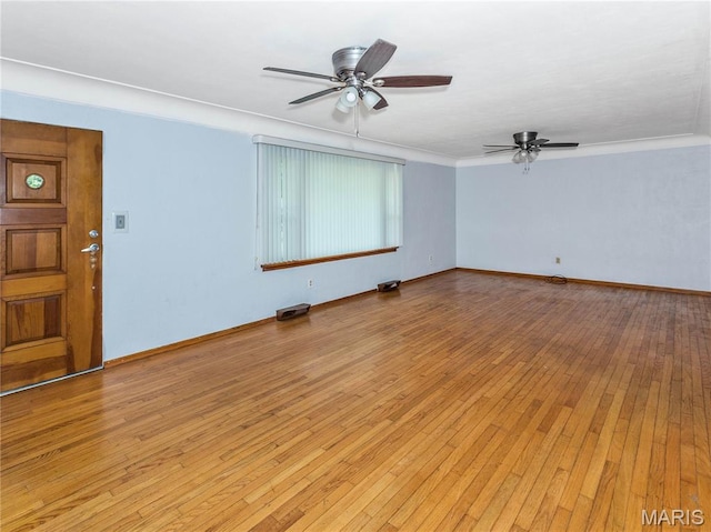 118 Alice Dr, Ofallon, IL 62269 - empty room featuring a ceiling fan, light wood-style floors, and crown molding