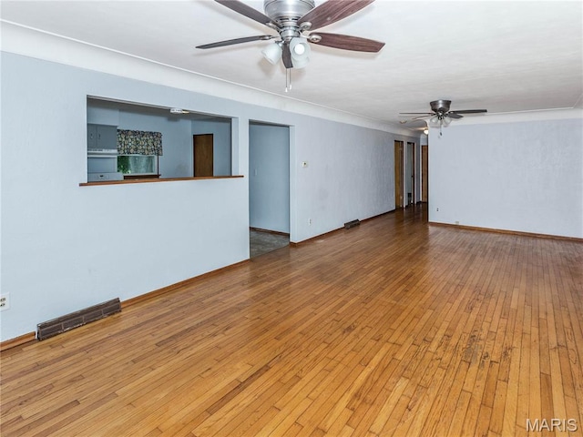 118 Alice Dr, Ofallon, IL 62269 - empty room featuring ceiling fan, wood-type flooring, and crown molding