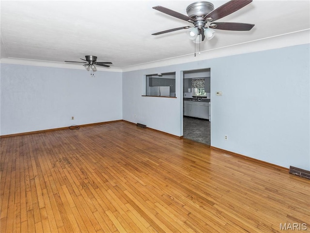 118 Alice Dr, Ofallon, IL 62269 - empty room featuring ceiling fan, light wood finished floors, and crown molding