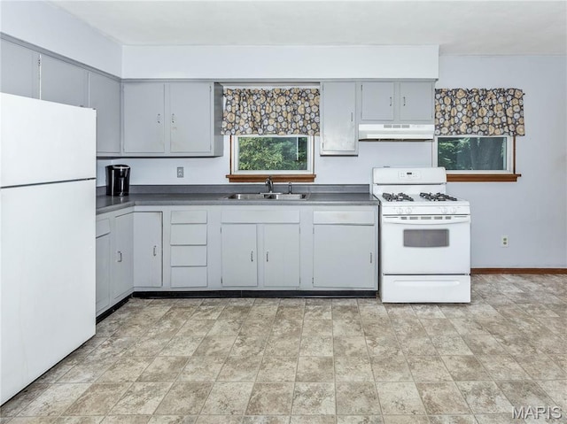 118 Alice Dr, Ofallon, IL 62269 - kitchen with white appliances, under cabinet range hood, gray cabinets, and dark countertops