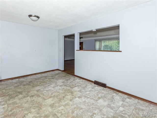 118 Alice Dr, Ofallon, IL 62269 - empty room featuring baseboards and tile patterned floors