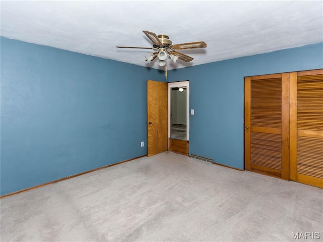 118 Alice Dr, Ofallon, IL 62269 - unfurnished bedroom with a closet, carpet floors, and a ceiling fan