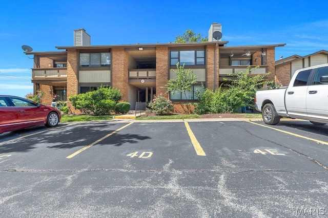 4 Fairways Cir Unit I, Saint Charles, MO 63303 - view of property featuring uncovered parking