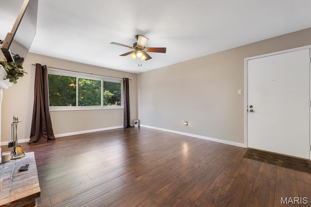 4 Fairways Cir Unit I, Saint Charles, MO 63303 - unfurnished living room featuring ceiling fan and dark wood-style flooring