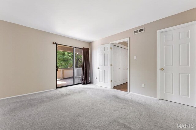 4 Fairways Cir Unit I, Saint Charles, MO 63303 - unfurnished bedroom featuring access to exterior and carpet