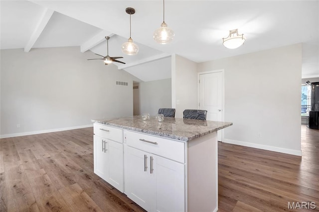 904 Ampere Pl, Lake St Louis, MO 63367 - kitchen featuring light wood-style floors, white cabinets, a kitchen island, a ceiling fan, and hanging light fixtures