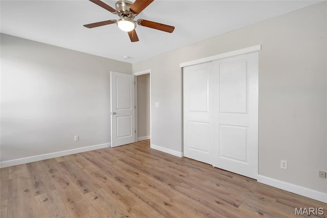 904 Ampere Pl, Lake St Louis, MO 63367 - unfurnished bedroom featuring wood finished floors, a closet, and a ceiling fan