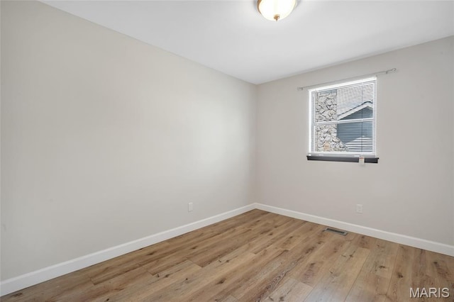 904 Ampere Pl, Lake St Louis, MO 63367 - unfurnished room featuring baseboards and light wood-style flooring