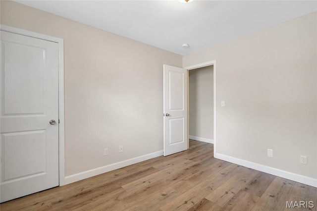 904 Ampere Pl, Lake St Louis, MO 63367 - unfurnished room featuring baseboards and wood finished floors