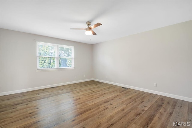 904 Ampere Pl, Lake St Louis, MO 63367 - spare room with a ceiling fan and wood finished floors