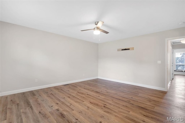 904 Ampere Pl, Lake St Louis, MO 63367 - empty room featuring a ceiling fan and wood finished floors