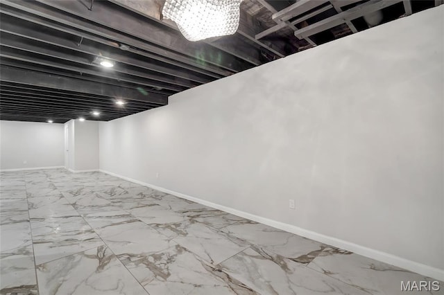904 Ampere Pl, Lake St Louis, MO 63367 - finished below grade area with a chandelier and marble look tiles
